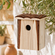 Birdhouse hanging with roof in bark