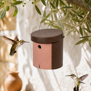 Birdhouse cylindrical with entrance round