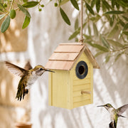 Birdhouse yellow with roof of shingles