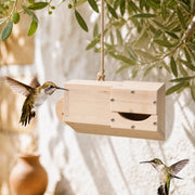 Birdhouse horizontal in wood with entrance in tunnel