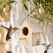 Birdhouse hanging in wood light with front engraved