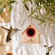 Birdhouse hanging in pine red