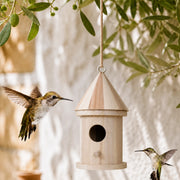 Birdhouse cylindrical in wood with roof pointed