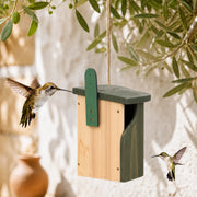 Birdhouse in wood with upright green