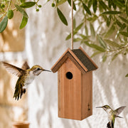 Birdhouse in wood with bitumen roof brown