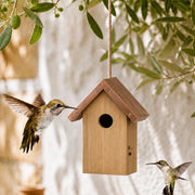Birdhouse in wood with copper roof brown