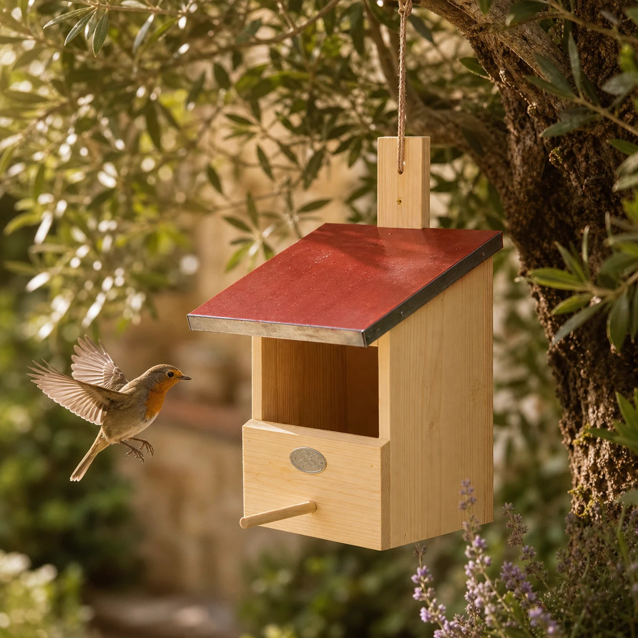 Birdhouse hanging in pine with zinc roof red
