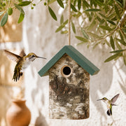 Birdhouse rustic in bark with green roof