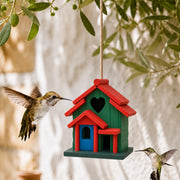 Birdhouse hanging in pine