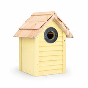 Birdhouse yellow with roof of shingles — photo 2