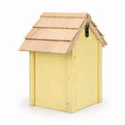 Birdhouse yellow with roof of shingles — photo 3